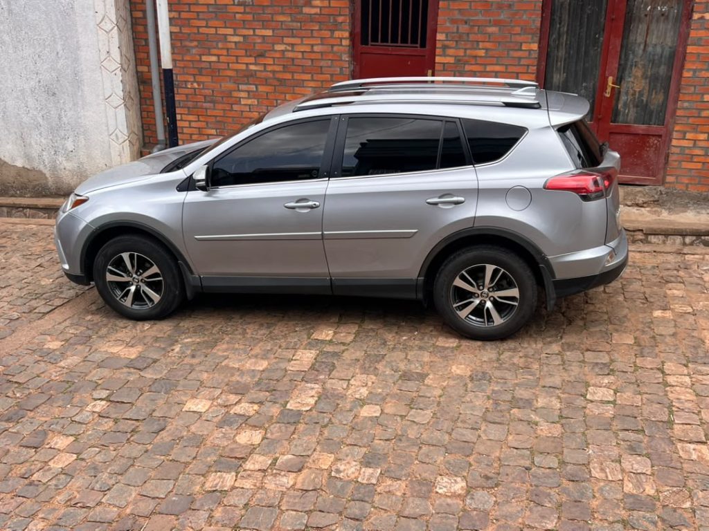 Toyota RAV4 4x4 parked on a scenic road during a self drive cars Rwanda trip with Freddy Car Rental.