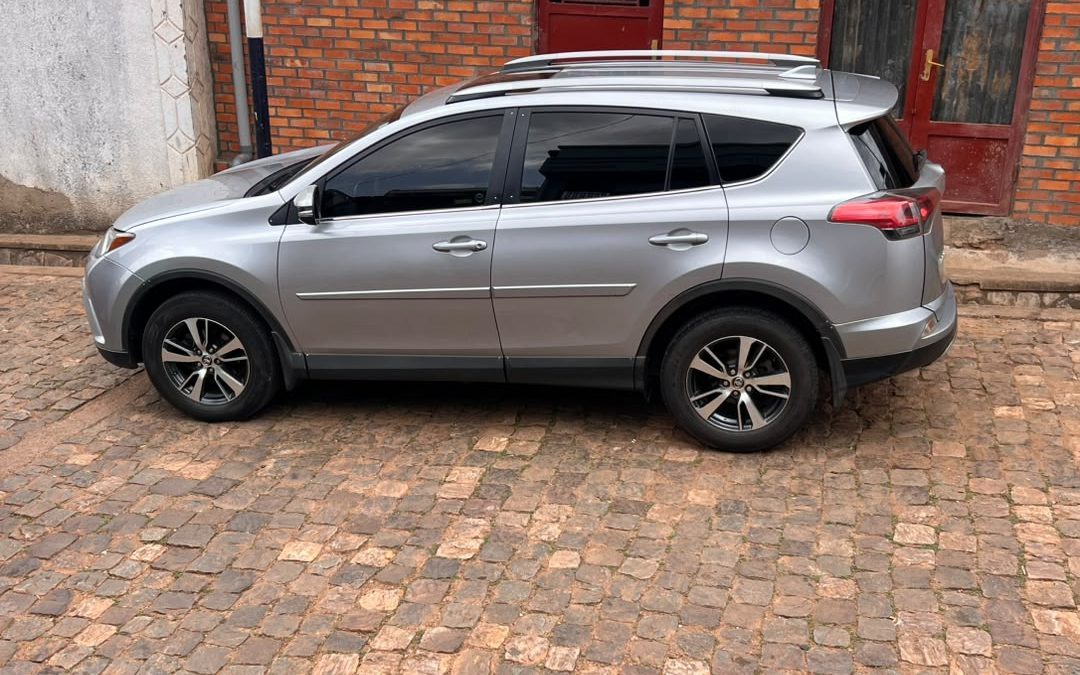 Toyota RAV4 4x4 parked on a scenic road during a self drive cars Rwanda trip with Freddy Car Rental.