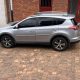 Toyota RAV4 4x4 parked on a scenic road during a self drive cars Rwanda trip with Freddy Car Rental.